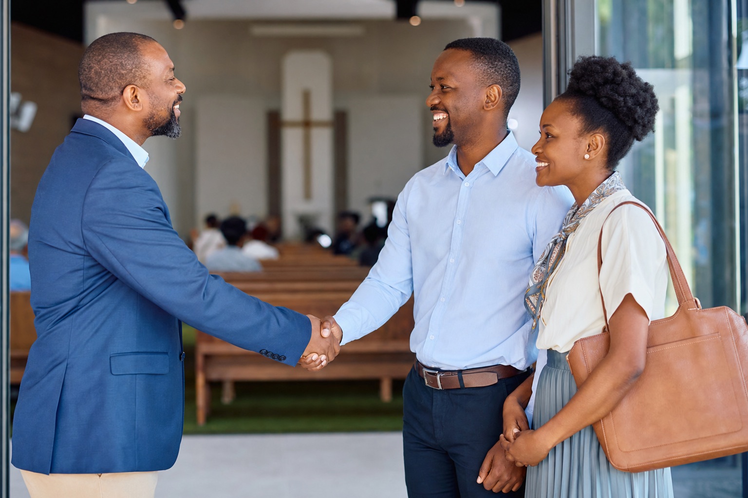 Pastor welcoming congregation members